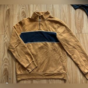 Orange quarter zip with navy strip